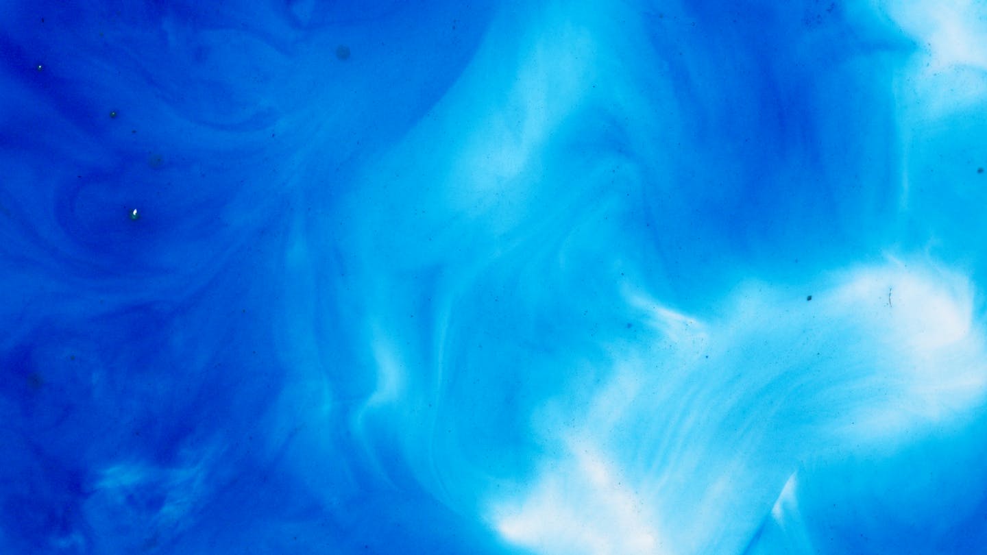Vibrant abstract blue watercolor texture, perfect for creative backgrounds and design elements.